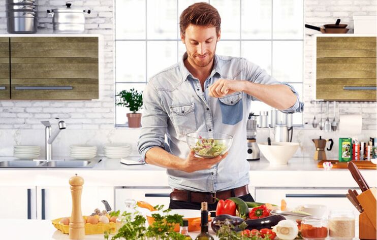 Man prepares green salad for increased potency